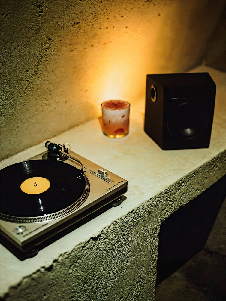 Turntable, candle and speaker