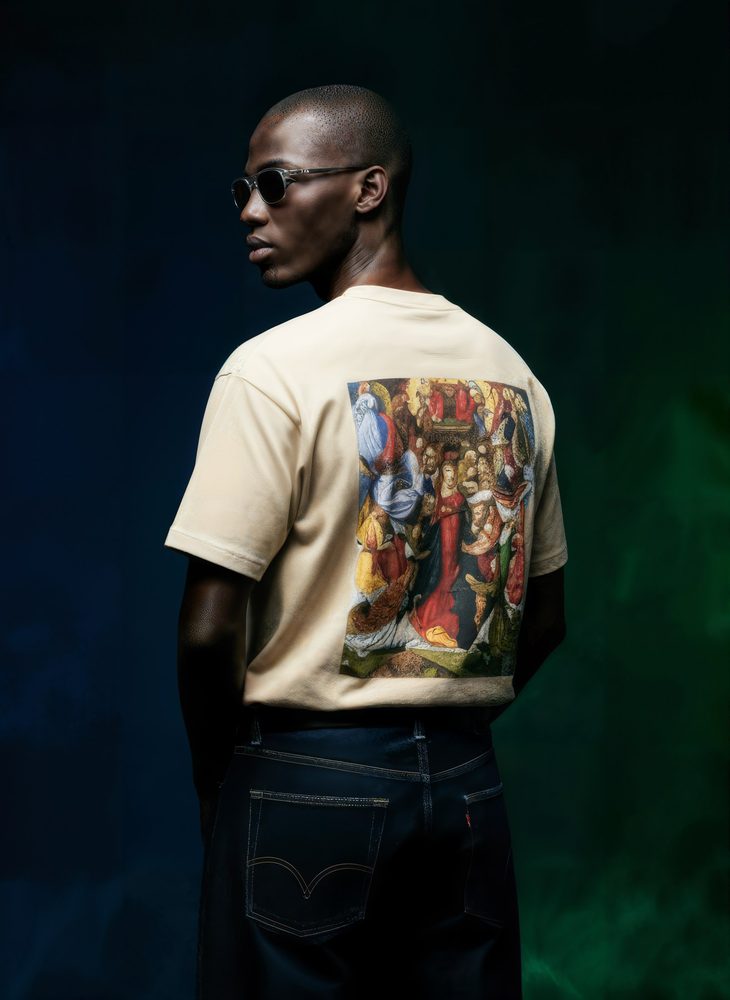 Back view of a cream T-shirt with a painted print